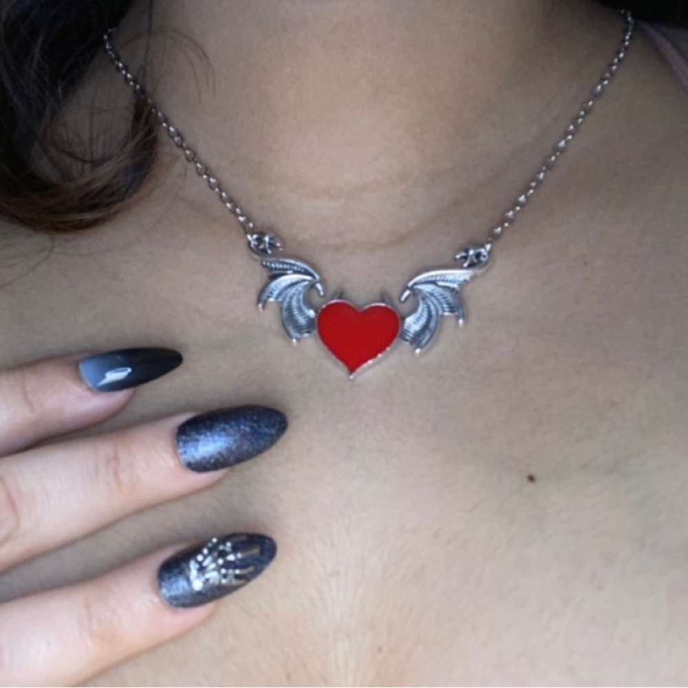 heart with wings around it, like Cupid's angel, nothing heavy